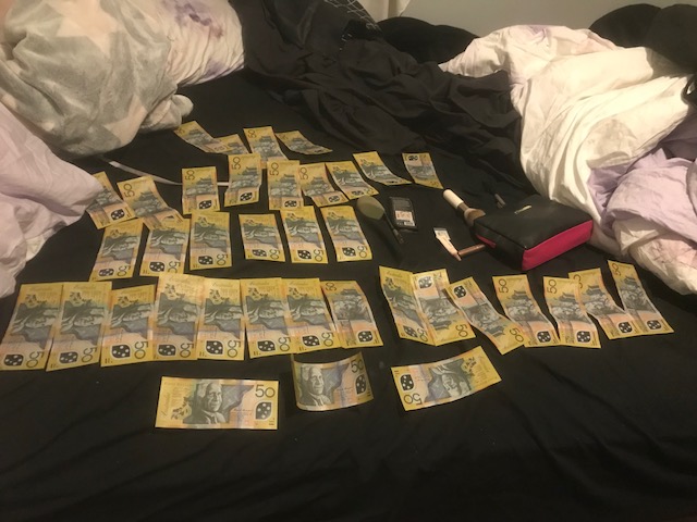 One thousand, eight hundred and fifty dollars seized during a search warrant in Rivett. Photo: Supplied by ACT Policing