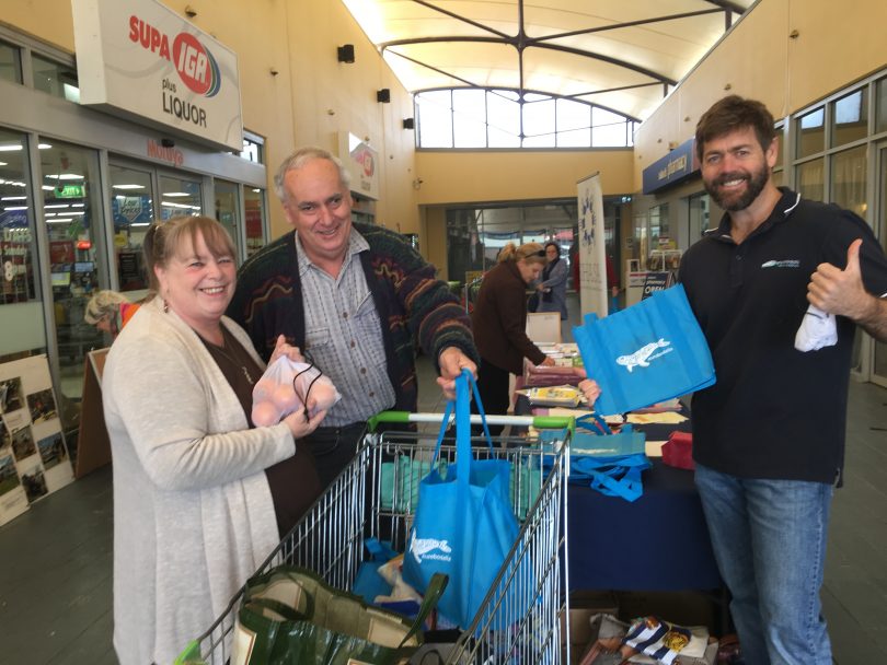 Shane and Louisa Duffy took advantage of Council’s recent Shopping Trolley Challenge in Moruya, where residents were encouraged to embrace reusables and reduce their waste. They are pictured with Council’s Waste Minimisation Officer Adam Patyus. Photo: Supplied.