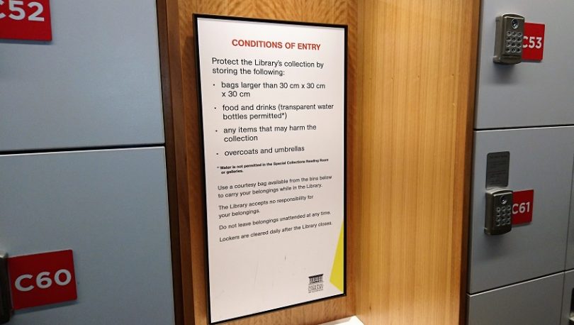 The NLA's signs about conditions of entry say food and drinks must be stored but “transparent water bottles" are okay. Photo: Brad Watts.