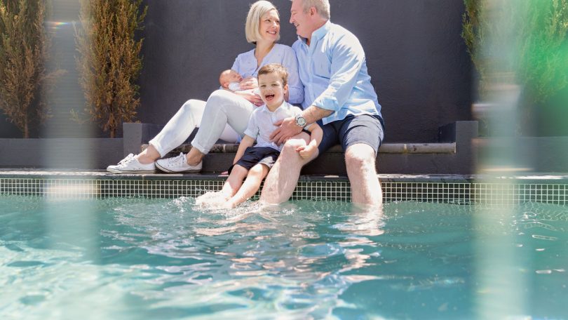 Emma and Jeff Gray and their two sons enjoying the pool.