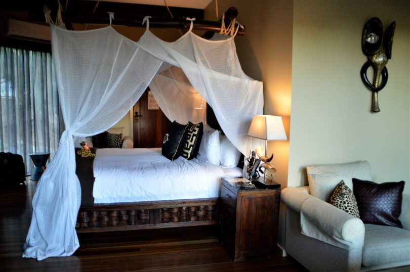 The attractive four-poster bed in the African-themed giraffe treehouse. 