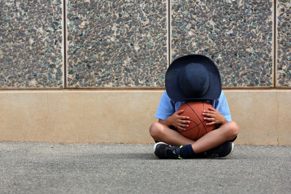 Sad child in playground