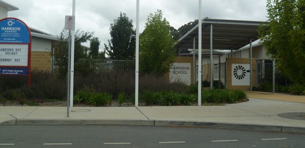 Seven garden beds with asbestos fenced off at Harrison School as investigations start into source of problem