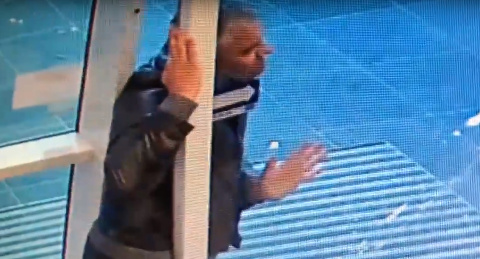 Police release CCTV footage of man kicking in automatic door