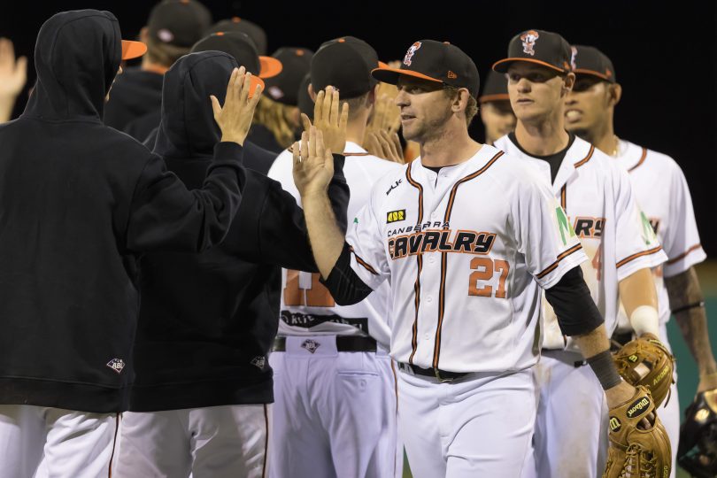 Cavalry players congratulate each other after a big win at MIT Ballpark last December