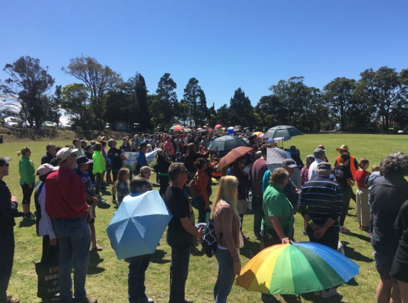 On the ground in the middle on the human sign on Lawrence Park, Tathra. Photo: Ian Campbell.