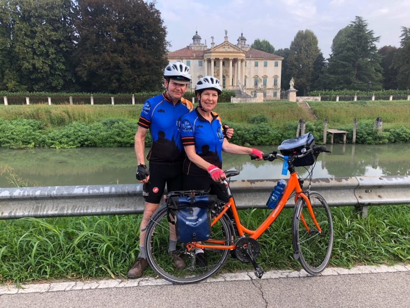 Mary Barr and husband Colin cycling in Italy after completing the course.