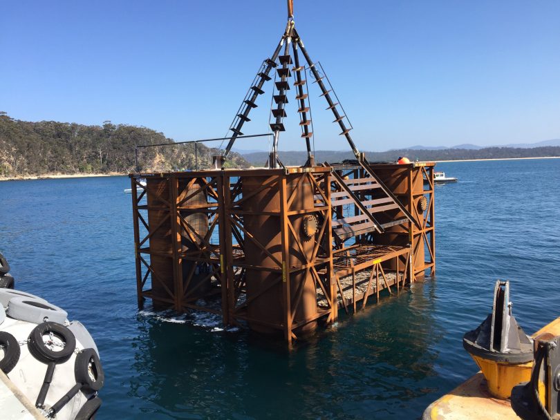 Merimbula's new artificial reef being lowered into place this week. Photo: Supplied