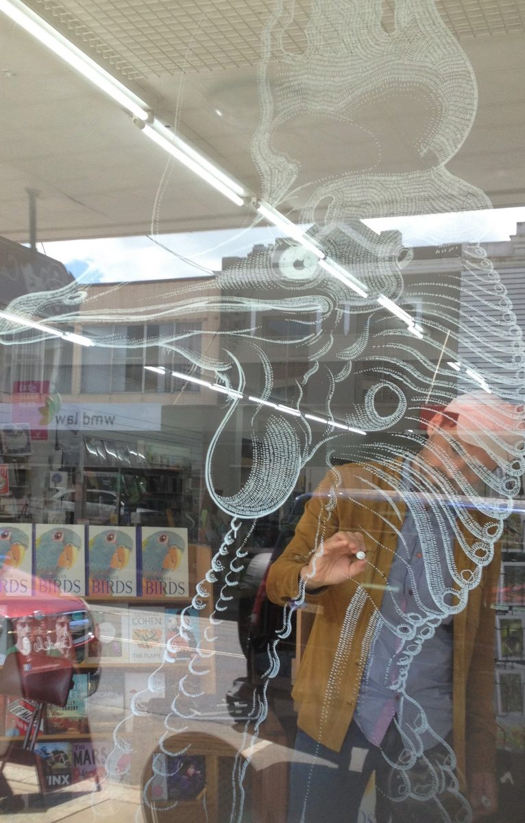 Chun is drawing on bookshop windows in Bega, Sydney, and Melbourne to celebrate the release of his first picture book, “Australian Birds,” published by Little Hare Books this month. Photo: Elka Wood.