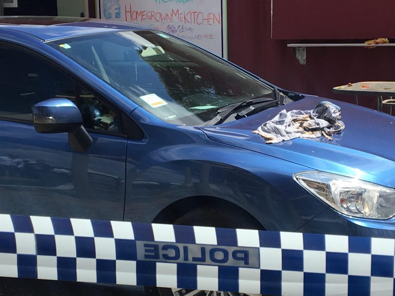 A burnt shirt left on a car after the explosion last night.