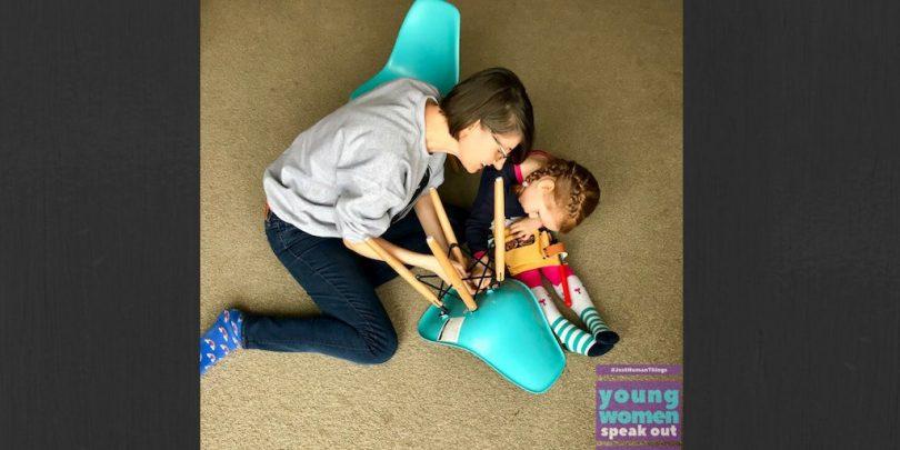 Woman and child fixing chair.