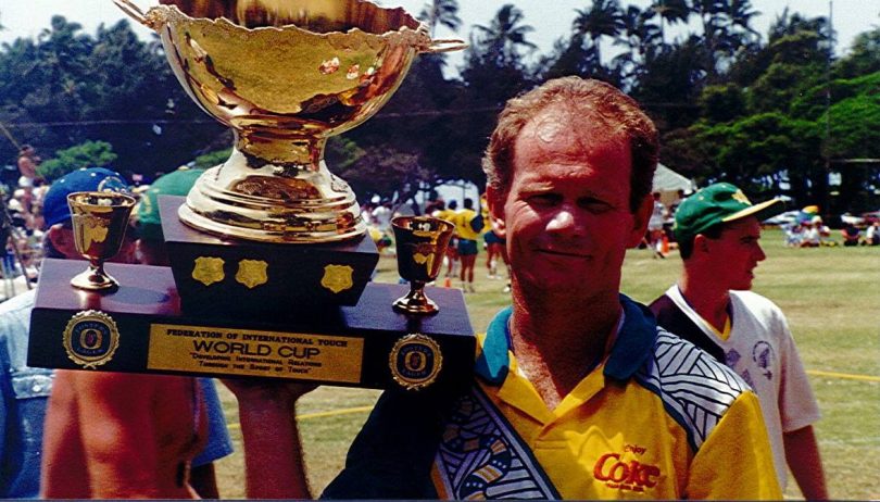 Lawless holding the World Cup trophy 