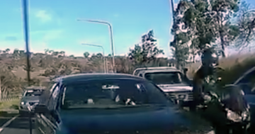 ACT police charge alleged motorist shown on viral video sideswiping motorcyclist