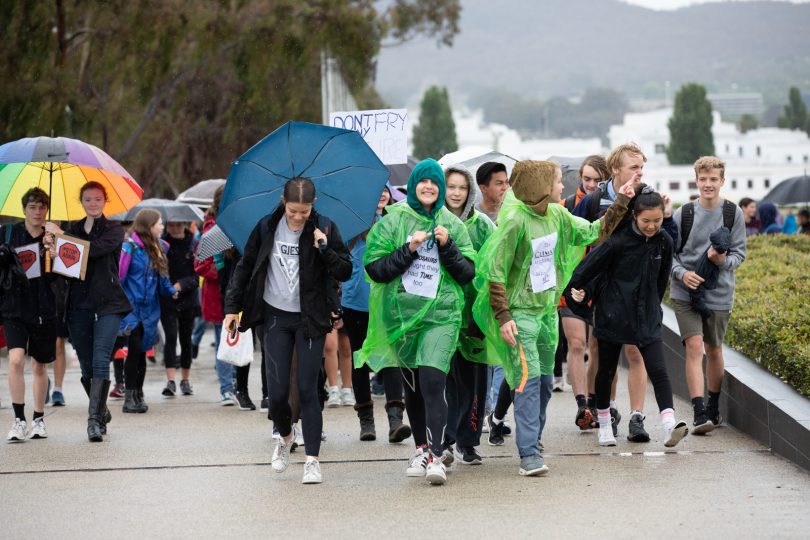 Young people brave the rain to attend the climate change rally and meetings in Parliament House: Photo: Olia Balabina.