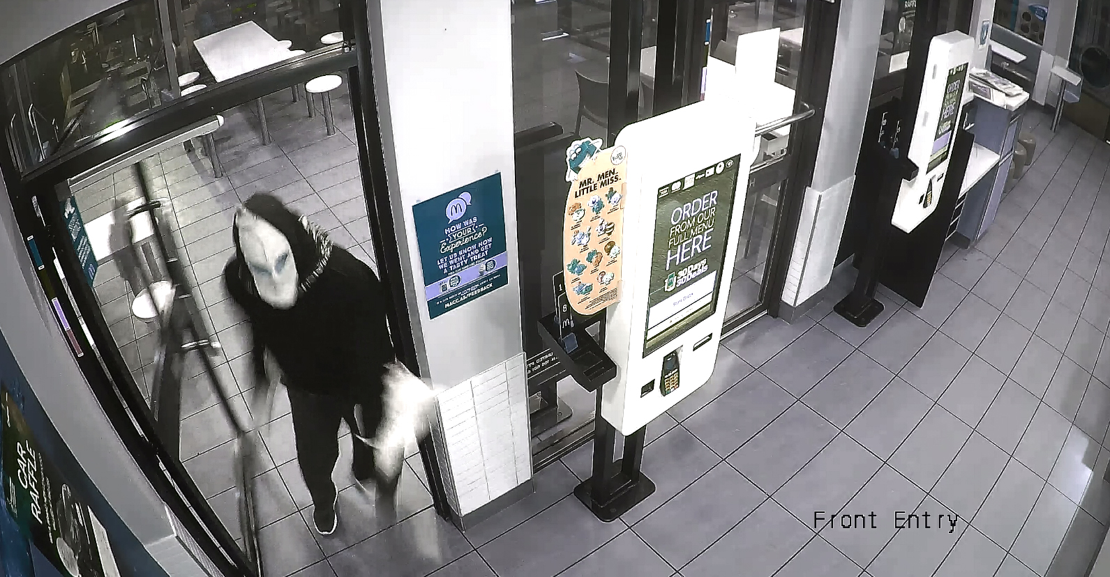 Police release CCTV images of masked man wanted on McDonalds aggravated robbery charges