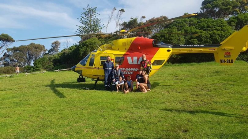 A happy ending. Two boys, and two girls from Victoria, rescued by the Westpac Rescue Helicopter Service near Bermagui's Blue Pool. Photo: Westpac Rescue Helicopter Service.
