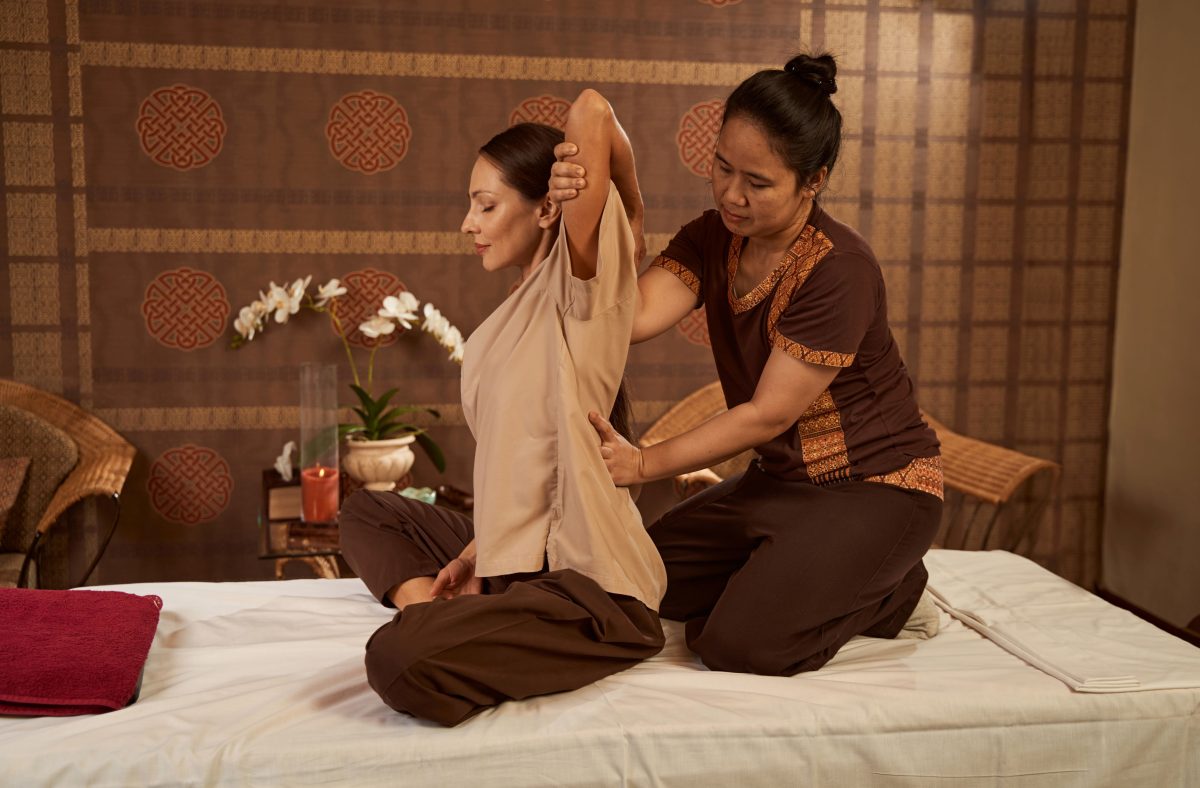 woman getting thai massage