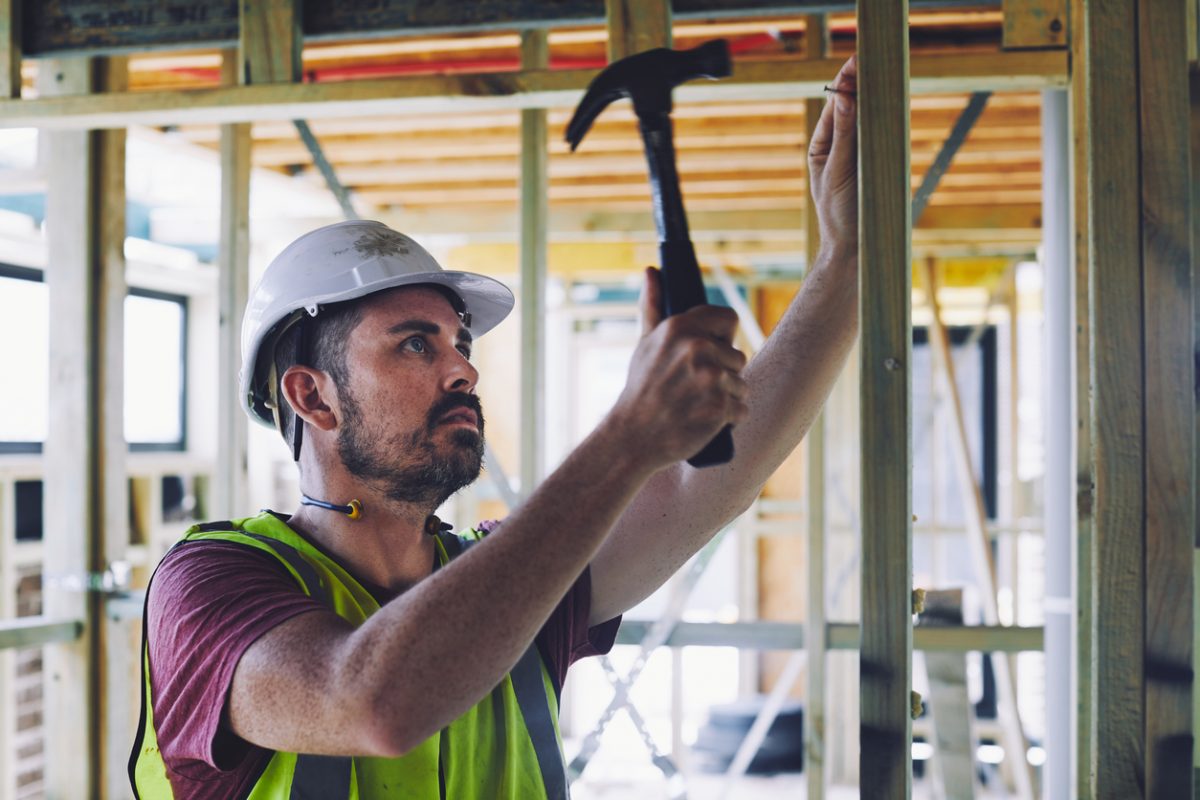 builder on site with hammer