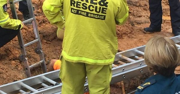 Stuck in the mud - firefighters rescue plumber from sticky situation