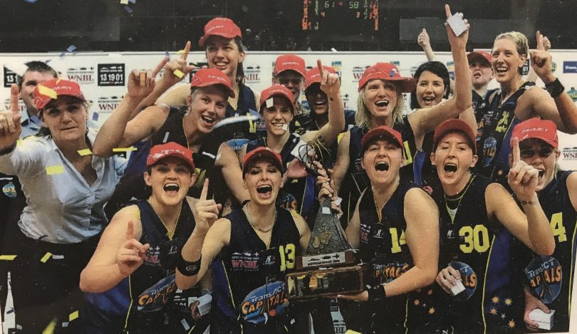 Canberra Capitals players celebrate winning the 2008-09 WNBL title