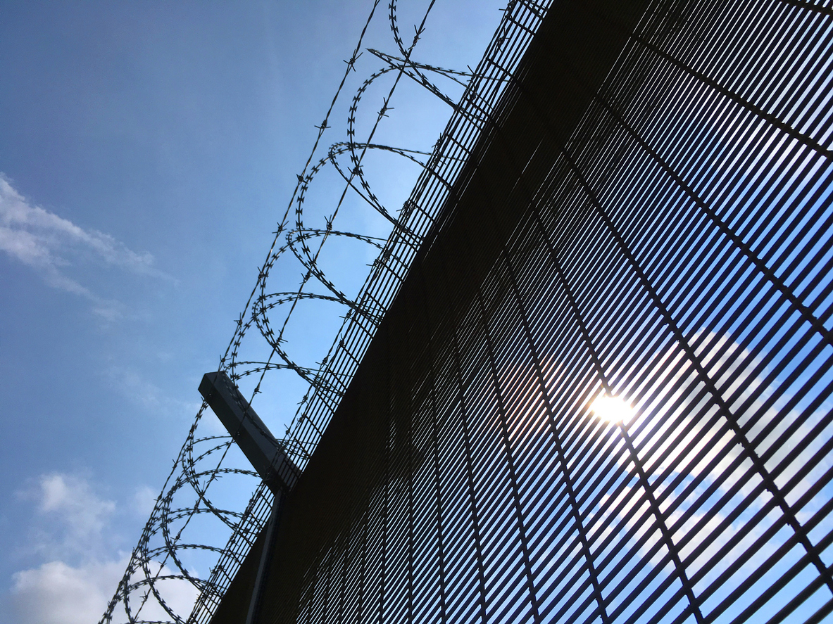 prison fence against the sky