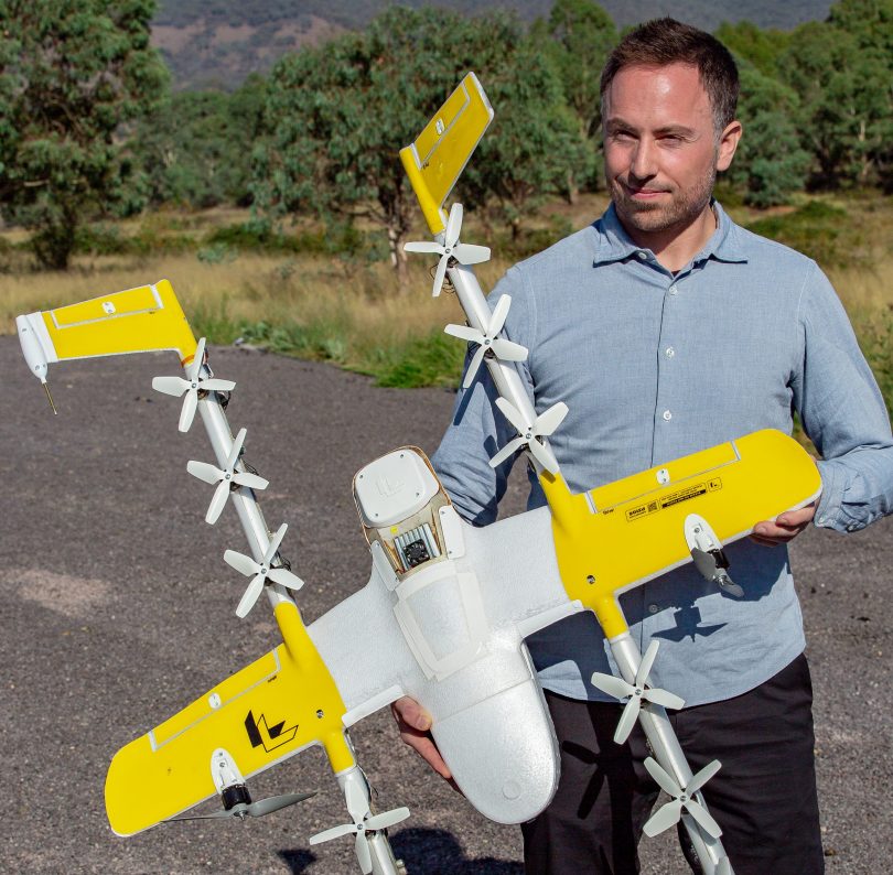 Man holding Wing drone.