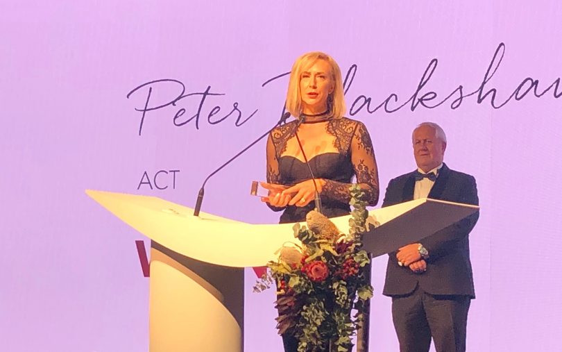 Narelle Casey from Peter Blackshaw Real Estate accepts the Community Service Award, dedicating the achievement to the late Rhys Summergreene. Photo: Supplied