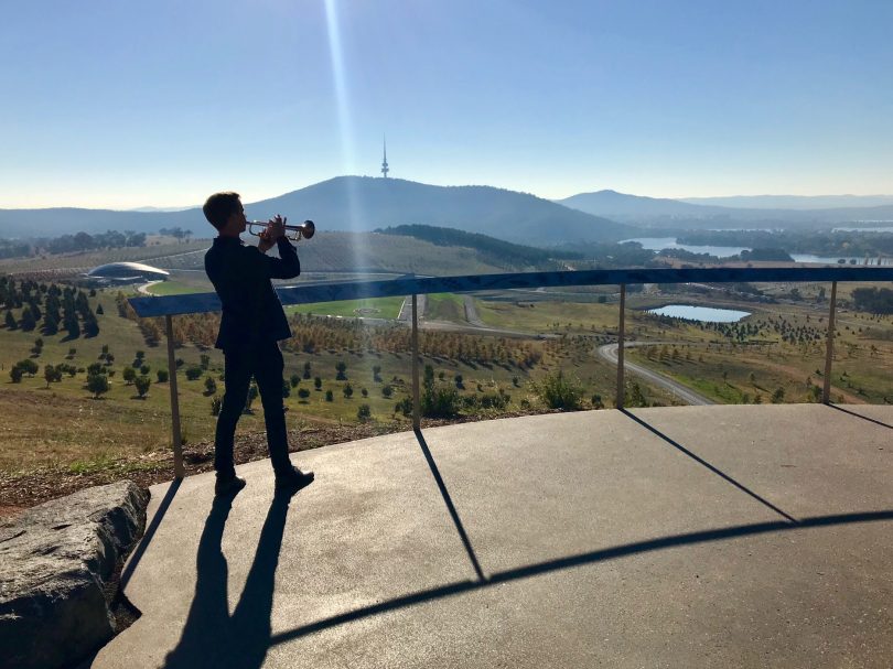 Alex Raupach blows trumpet at Arboretum