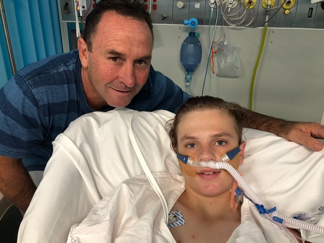 Ricky Stuart pays TJ a visit on Christmas morning in ICU. Photo: Supplied.