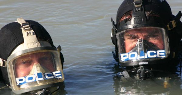 Police find body after large-scale search for fisherman swept off rocks at Jervis Bay