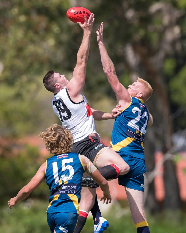 AFL players jumping