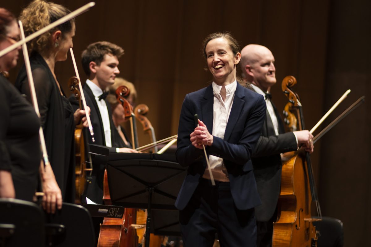 conductor with orchestra