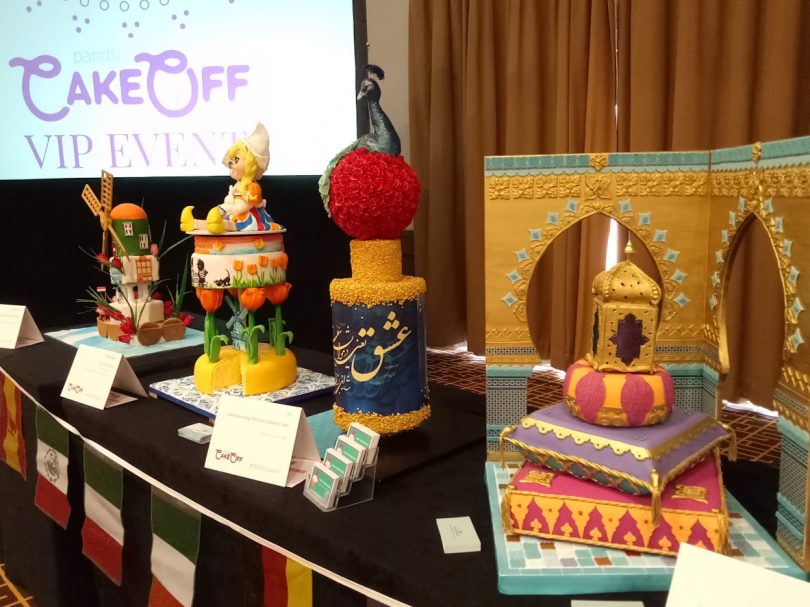 Left to right Two Dutch Windmill cakes - far left by Shane Rattenbury MLA and partner, Iranian peacock and a gold Moroccan lantern with fickering tea light inside