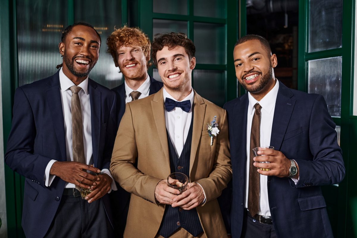 four men in smart suits for bachelor party