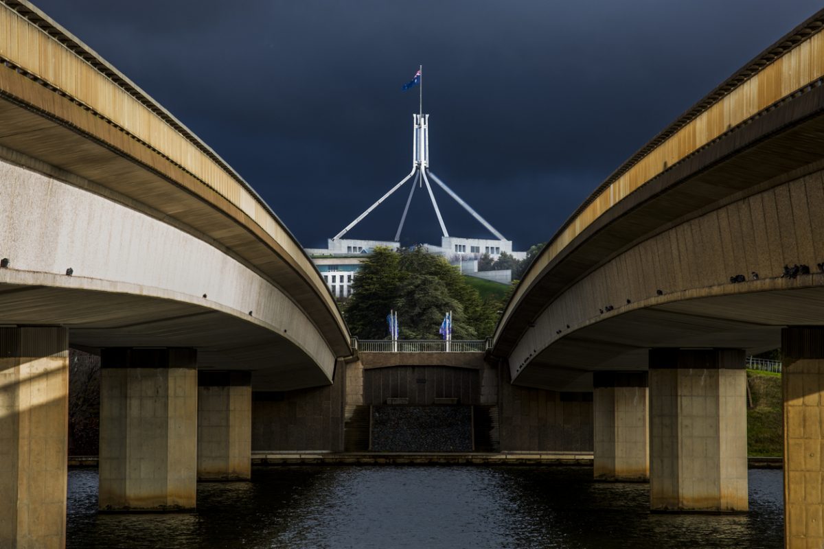 Looking between the spans of Commonwealth Avenue Bridge towards Parliament House.
