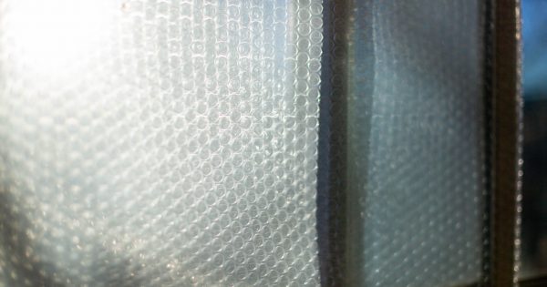 Renters bubble wrap windows as Canberra shivers through winter