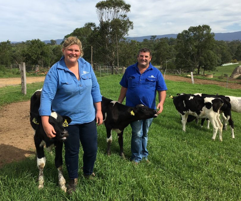 Ashleigh and X Rood with poddy calves on their dairy farm