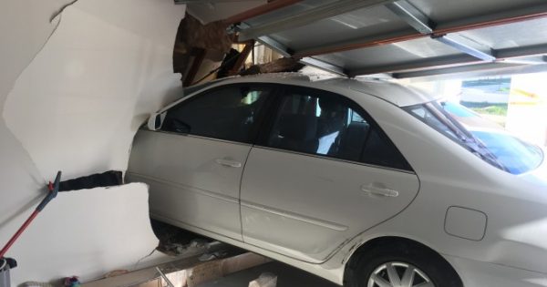 Car crashes into home in Taylor