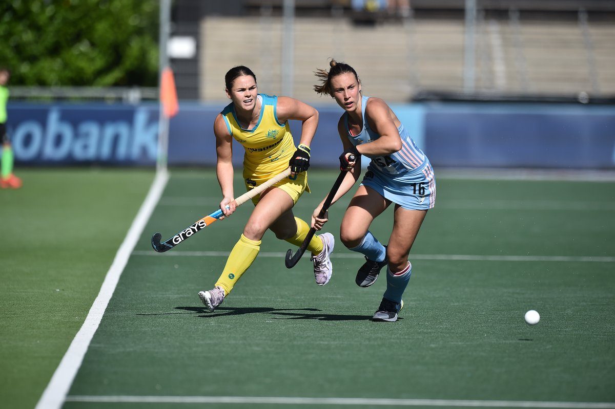 Kalindi Commerford and another hockey player in action