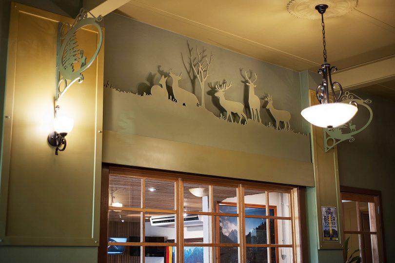  Carvings of deer standing amongst alpine trees complete the Bavarian feel.