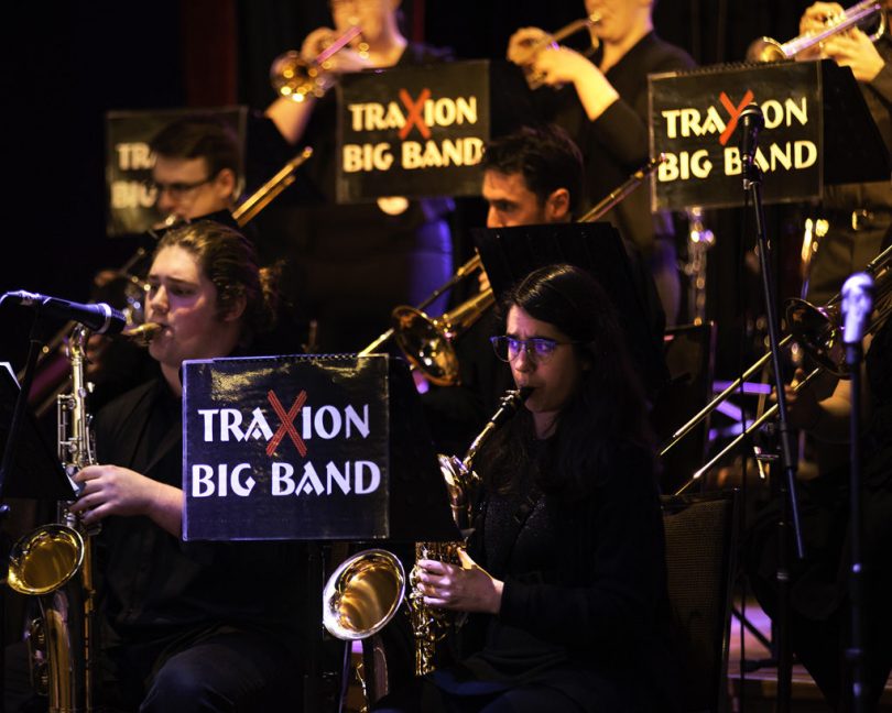 Photograph of saxophone section of TraXion Big Band performing