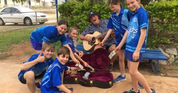 Principal busking his school's way to Canberra for once-in-a-lifetime trip