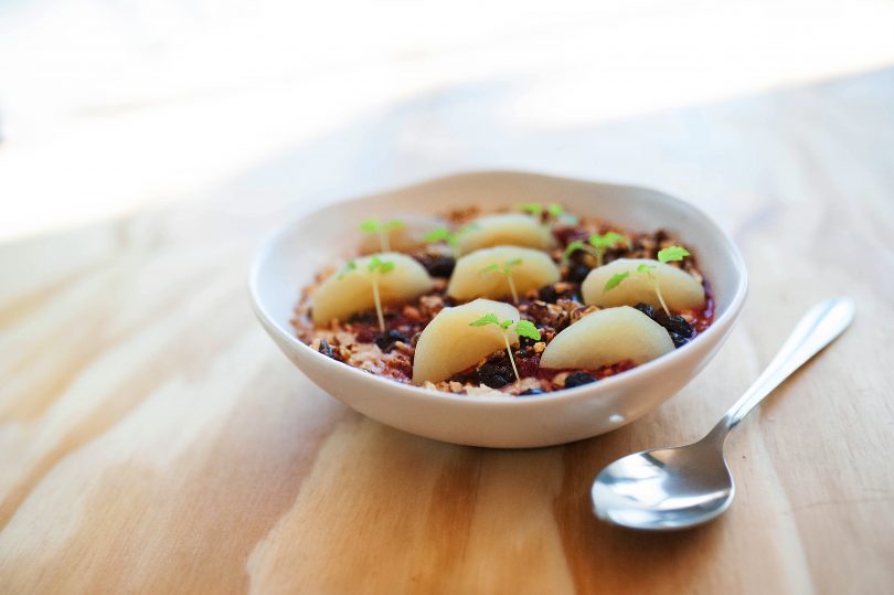 The winter porridge is a generous bowl of coconut porridge, mixed berry compote, caramelised pecan and candied apple.