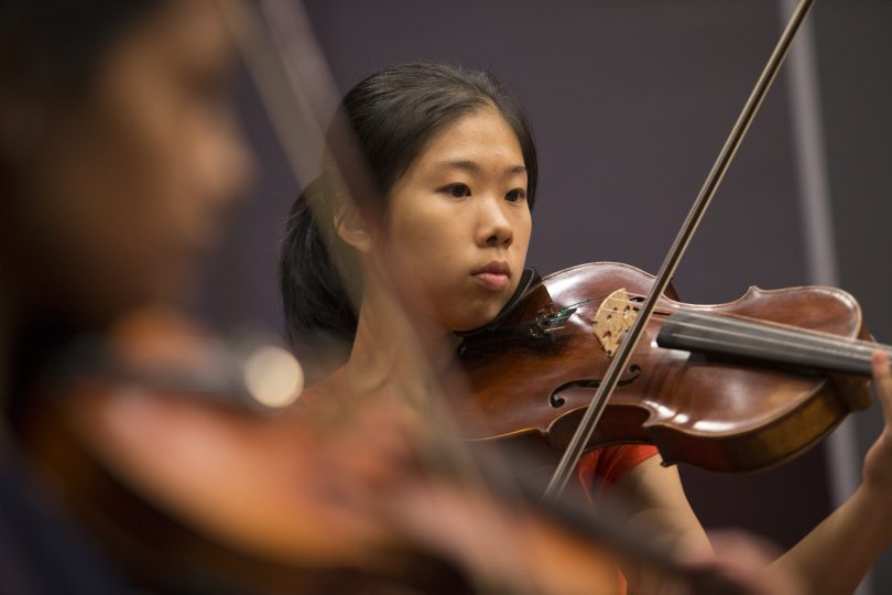 Young woman playing a violin