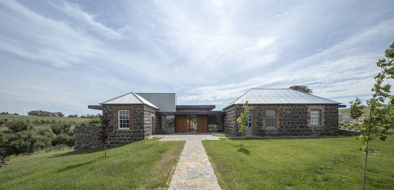 Two bluestone outbuildings have become part of an exceptional home at Yass about to be auctioned. Photos: Supplied. 