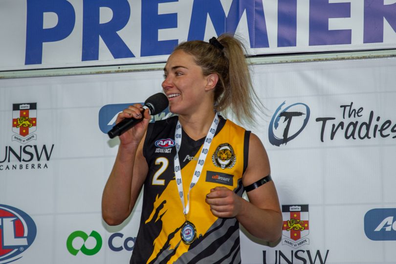 Hannah Dunn with medal, speaking after AFL Canberra grand final.