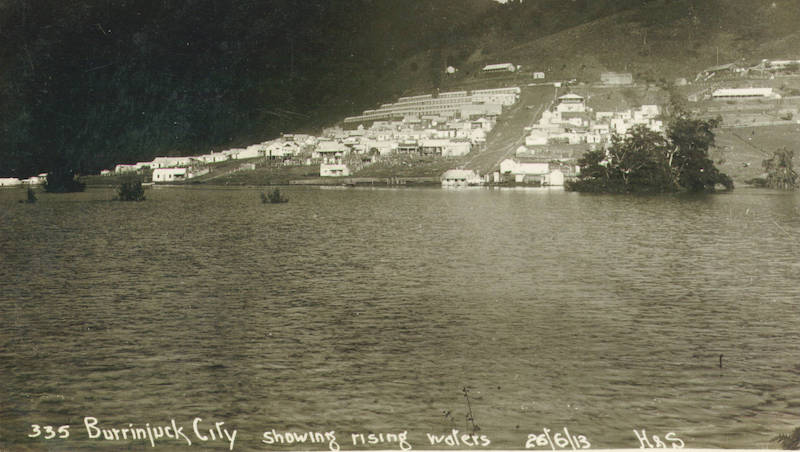 The settlement near rising waters of Burrinjuck Dam.