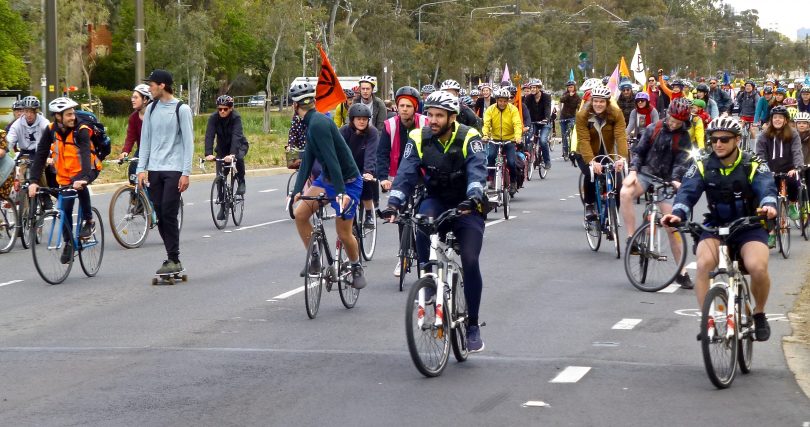 Police escort protesters