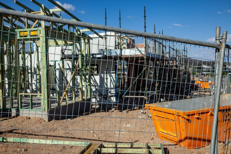 Empty ACT construction site with fence around it.