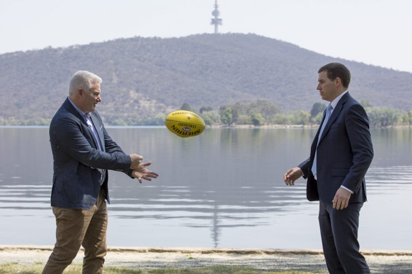 James Milligan and Alistair Coe passing football